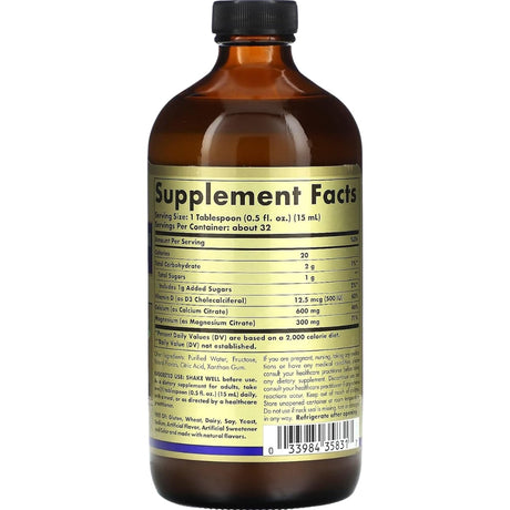 Etiqueta posterior del frasco Solgar de citrato de calcio, magnesio y vitamina D3 líquido sabor arándanos, con información del suplemento, modo de uso y advertencias, 473 ml